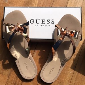 Guess rose gold bow flip flops